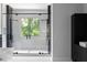 Luxurious glass-enclosed shower with a large window, offering a spa-like experience at 1610 Niskey Lake Rd, Atlanta, GA 30331