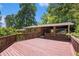 Expansive wooden deck overlooking the wooded backyard offers a tranquil retreat at 2595 Woodhill Cir, Atlanta, GA 30344