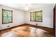 Bright bedroom with wood floors and two large windows at 2595 Woodhill Cir, Atlanta, GA 30344