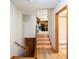 Hallway with stairs leading to the main level, showcasing access to the bathroom and kitchen at 2595 Woodhill Cir, Atlanta, GA 30344