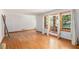 Open living room with hardwood floors, large windows, and bright, natural light at 2595 Woodhill Cir, Atlanta, GA 30344