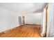 Bright living room with hardwood floors, large windows, and access to other rooms at 2595 Woodhill Cir, Atlanta, GA 30344