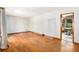 Spacious living room featuring gleaming hardwood floors, natural light, and neutral paint at 2595 Woodhill Cir, Atlanta, GA 30344