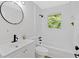 Bathroom featuring a white vanity, toilet, tub, and shower with sleek, modern fixtures at 5689 Woodland Dr, Acworth, GA 30102