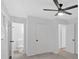Bedroom featuring neutral carpet, white walls, and access to a bathroom at 5689 Woodland Dr, Acworth, GA 30102
