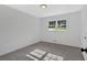 Bright bedroom featuring neutral walls, plush carpeting, and a sun-filled window offering an inviting space at 5689 Woodland Dr, Acworth, GA 30102