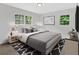 Cozy bedroom with neutral colors, plush rug, and plenty of natural light at 5689 Woodland Dr, Acworth, GA 30102