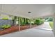 Spacious carport with view of landscaping, providing sheltered parking and easy access to the entrance at 5689 Woodland Dr, Acworth, GA 30102