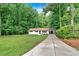 Ranch style home with mature trees, long driveway and beautiful lawn at 5689 Woodland Dr, Acworth, GA 30102