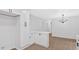 Clean, white kitchen offers modern cabinetry, quartz countertops, and new flooring at 5689 Woodland Dr, Acworth, GA 30102