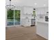 Modern kitchen with white cabinets, stainless steel appliances, and an island with bar seating at 5689 Woodland Dr, Acworth, GA 30102