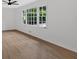 Living space with beautiful new floors, fresh paint, and large windows at 5689 Woodland Dr, Acworth, GA 30102