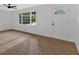 Bright, spacious living room with hardwood floors and a front door at 5689 Woodland Dr, Acworth, GA 30102
