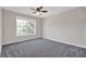Cozy bedroom with neutral paint, carpet, and a ceiling fan at 6645 Crest Wood Ln, Douglasville, GA 30135