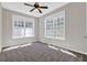 Cozy bedroom with plush carpet and dual windows allowing for plenty of natural light at 6645 Crest Wood Ln, Douglasville, GA 30135