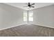 Bedroom features natural light, ceiling fan, and neutral paint at 6645 Crest Wood Ln, Douglasville, GA 30135