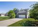 Beautiful home featuring stone accents, double garage, and mature landscaping at 6645 Crest Wood Ln, Douglasville, GA 30135