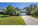 Charming two-story home with a well-manicured lawn and an inviting facade at 6645 Crest Wood Ln, Douglasville, GA 30135