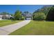 Attractive home with a long driveway, lush lawn, and manicured landscaping at 6645 Crest Wood Ln, Douglasville, GA 30135