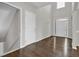 Bright foyer with gleaming hardwood floors, high ceilings, and a view of the front door and staircase at 6645 Crest Wood Ln, Douglasville, GA 30135