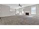 Open living room with fireplace, carpet, and lots of natural light at 6645 Crest Wood Ln, Douglasville, GA 30135