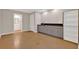 Versatile living space with built-in cabinets, a sink, and durable flooring, ideal for various activities at 6645 Crest Wood Ln, Douglasville, GA 30135