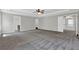 Spacious main bedroom with ceiling fan and multiple doorways at 6645 Crest Wood Ln, Douglasville, GA 30135