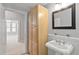 Bathroom featuring a pedestal sink, mirror and vanity, tile flooring, and natural light at 850 Piedmont Ne Ave # 3304, Atlanta, GA 30308