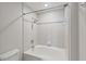 Bathroom showing a white bathtub and shower featuring tiled walls and silver hardware at 850 Piedmont Ne Ave # 3304, Atlanta, GA 30308