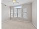 Bedroom with large windows with blinds, ceiling fan, neutral paint and plenty of room at 850 Piedmont Ne Ave # 3304, Atlanta, GA 30308