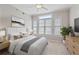 Bedroom with large windows with blinds, ceiling fan, neutral paint and plenty of room at 850 Piedmont Ne Ave # 3304, Atlanta, GA 30308