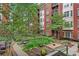 Courtyard with a seating area, landscaped beds, and a variety of plants and small trees at 850 Piedmont Ne Ave # 3304, Atlanta, GA 30308