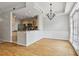Bright dining area with hardwood floors and adjacent kitchen with stainless steel appliances at 850 Piedmont Ne Ave # 3304, Atlanta, GA 30308
