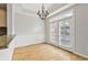Bright dining area with backyard access, hardwood floors, and adjacent kitchen at 850 Piedmont Ne Ave # 3304, Atlanta, GA 30308