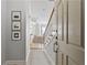 Inviting entryway showcasing staircase, tiled floor, and seamless transition to the living spaces beyond at 850 Piedmont Ne Ave # 3304, Atlanta, GA 30308