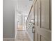 Entryway with tiled floor leading to hardwood floors and staircase with white railing at 850 Piedmont Ne Ave # 3304, Atlanta, GA 30308