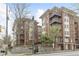 The Dakota apartments feature brick facade, balconies, and a gated entrance, offering urban living at 850 Piedmont Ne Ave # 3304, Atlanta, GA 30308