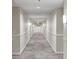 Long hallway with neutral paint and carpet flooring, featuring lighting throughout the ceiling at 850 Piedmont Ne Ave # 3304, Atlanta, GA 30308