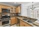 Modern kitchen with stainless steel appliances, granite counters, and breakfast bar at 850 Piedmont Ne Ave # 3304, Atlanta, GA 30308