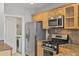 Well-lit kitchen featuring stainless steel appliances and granite countertops at 850 Piedmont Ne Ave # 3304, Atlanta, GA 30308