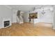 Open living area featuring a fireplace, staircase, and view into the kitchen at 850 Piedmont Ne Ave # 3304, Atlanta, GA 30308