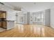 Spacious living room with hardwood floors, bay windows, and open design offers abundant natural light at 850 Piedmont Ne Ave # 3304, Atlanta, GA 30308