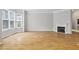 Open living room layout showcases hardwood floors, fireplace, and bay windows, creating a bright and inviting ambiance at 850 Piedmont Ne Ave # 3304, Atlanta, GA 30308