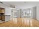 Bright living room featuring hardwood floors, a chandelier, and multiple windows at 850 Piedmont Ne Ave # 3304, Atlanta, GA 30308