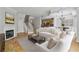 Living room with staircase, open to kitchen and dining, fireplace, and hardwood floors at 850 Piedmont Ne Ave # 3304, Atlanta, GA 30308