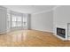 Spacious living room boasts hardwood floors, fireplace, and bay windows, perfect for creating a warm atmosphere at 850 Piedmont Ne Ave # 3304, Atlanta, GA 30308