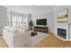 Cozy living room with fireplace, bay window, hardwood floors, and ample seating for relaxing or entertaining at 850 Piedmont Ne Ave # 3304, Atlanta, GA 30308