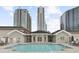 Outdoor pool offering lounge seating, and views of the surrounding building structures at 850 Piedmont Ne Ave # 3304, Atlanta, GA 30308
