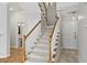 Welcoming foyer showcasing a carpeted staircase with wooden banister at 850 Piedmont Ne Ave # 3304, Atlanta, GA 30308