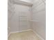 Organized walk-in closet with multiple shelves for storage solutions at 850 Piedmont Ne Ave # 3304, Atlanta, GA 30308